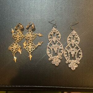 Two pairs of long sparkly earring - gold are clips and other pair - hooks